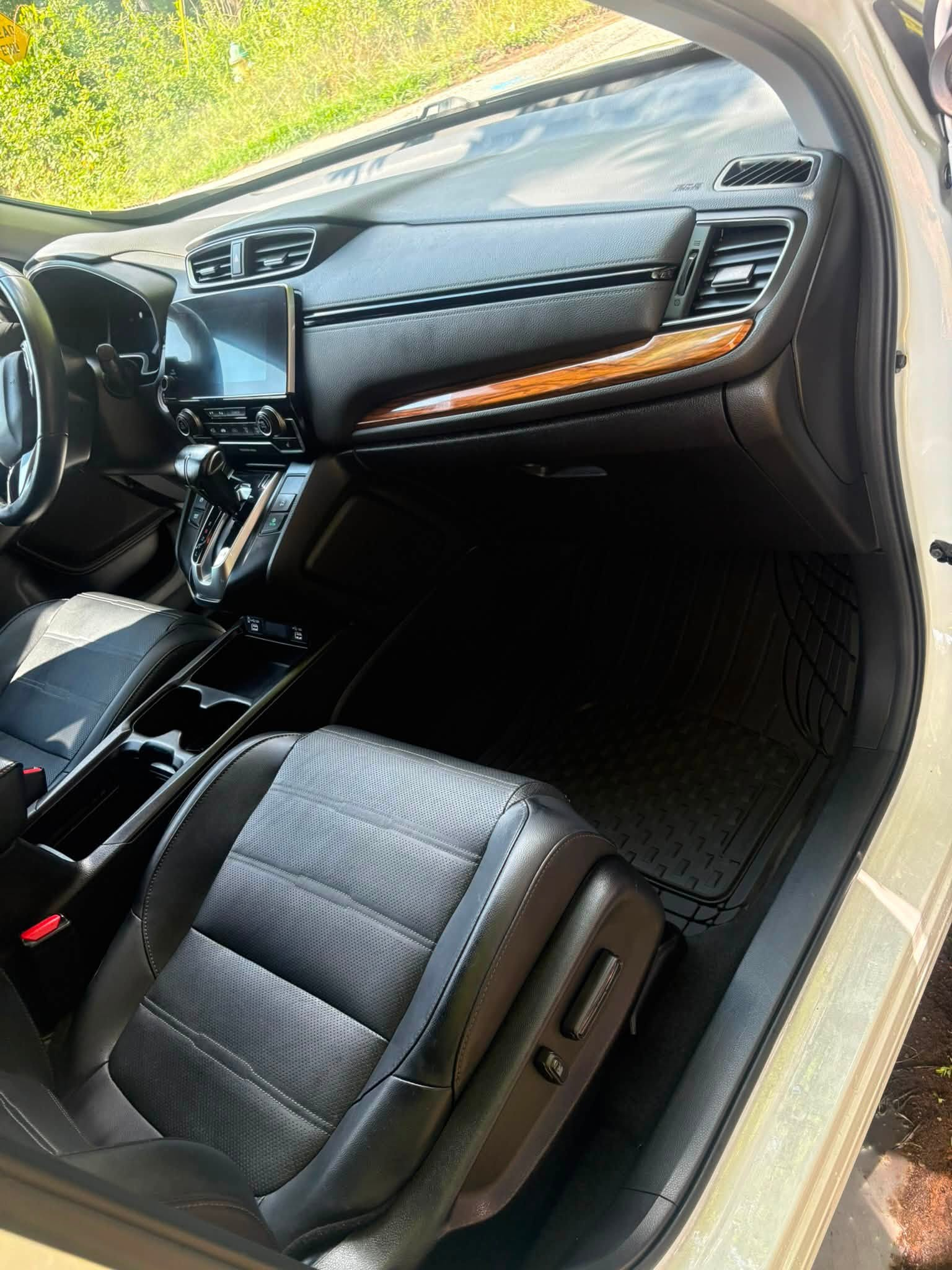 Passenger side dash, vents, and floor mat after detailing